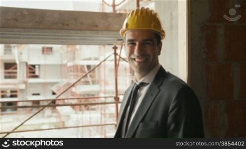 Professional people at work, portrait of happy and confident architect with safety helmet in construction site, smiling at camera. Sequence