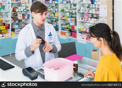 Professional pharmacist advise or explain property of qualified medical product to customer in pharmacy, druggist answer to client healthcare inquiry, medical service and consultation concept.. Pharmacist advise or explain property of qualified medical product to customers.