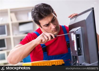 Professional repair engineer repairing broken tv