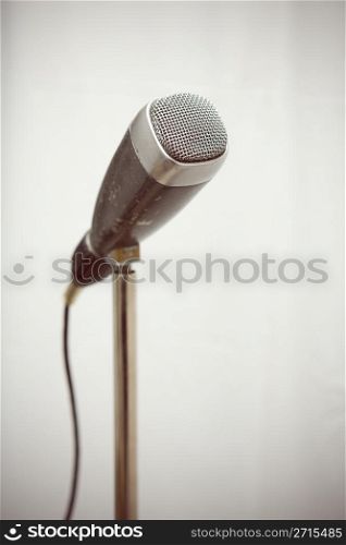 Professional retro microphone from sixties on a stand