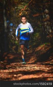 Professional runner in the woods during a workout