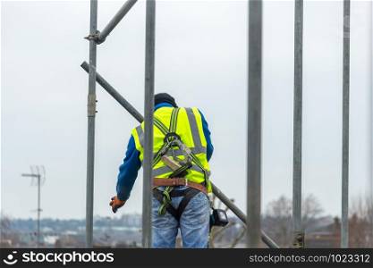 Professional Scaffolders erecting scaffolding on a building in the UK