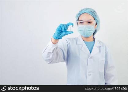 Professional scientist or doctor holding Covid-19 vaccine vial in hand of at laboratory for treatment with mask gloves and lab coat on white background. Health business and industry concept.