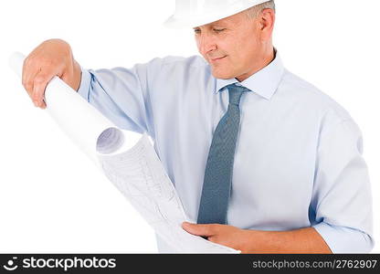 Professional senior architect with protective helmet looking at blueprints