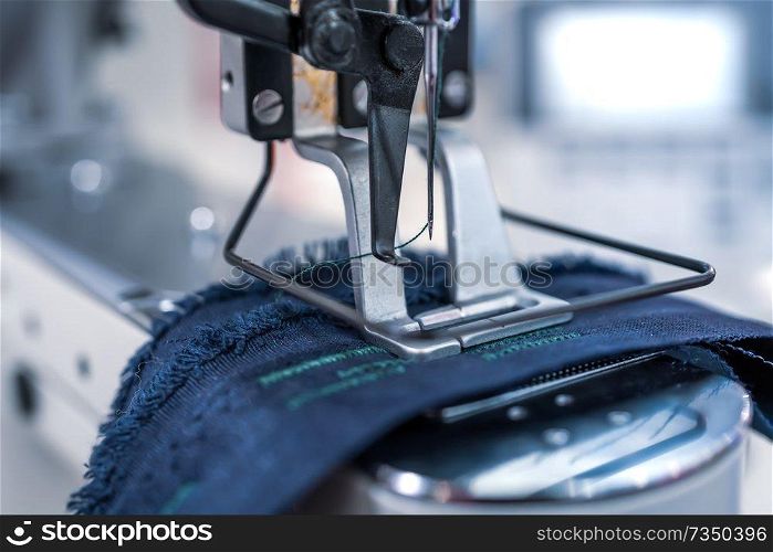 Professional sewing machine close-up. Modern textile industry.