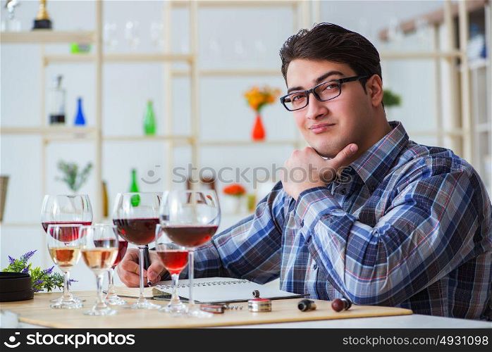 Professional sommelier tasting red wine