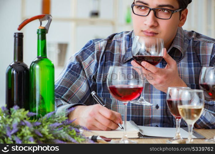 Professional sommelier tasting red wine