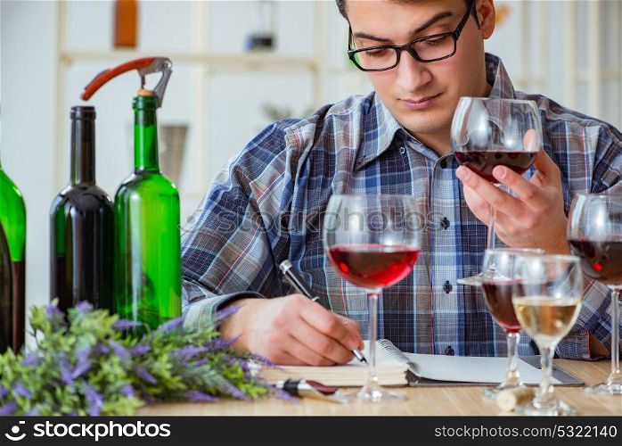 Professional sommelier tasting red wine . The professional sommelier tasting red wine