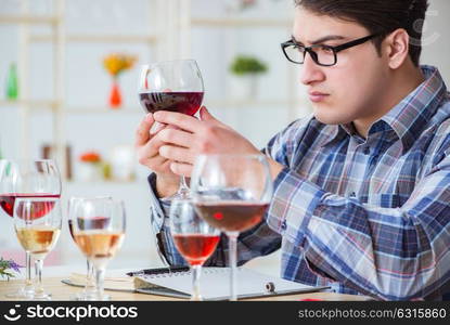 Professional sommelier tasting red wine . The professional sommelier tasting red wine