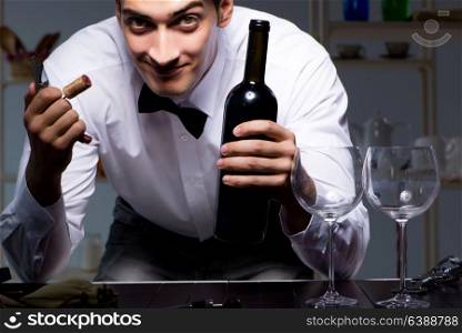 Professional sommelier tasting wine in restaurant