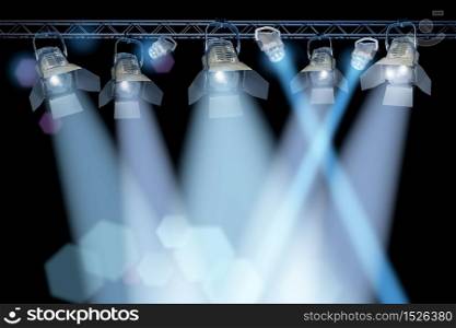 Professional stage spotlight lamps rack on black background. Stage spotlight rack