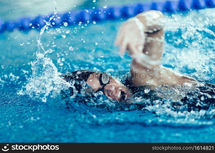 Professional swimmer, swimming race, indoor pool