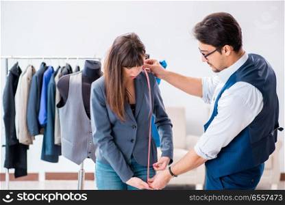 Professional tailor taking measurements for formal suit