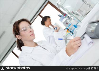 professional woman wearing goggle in a laboratory
