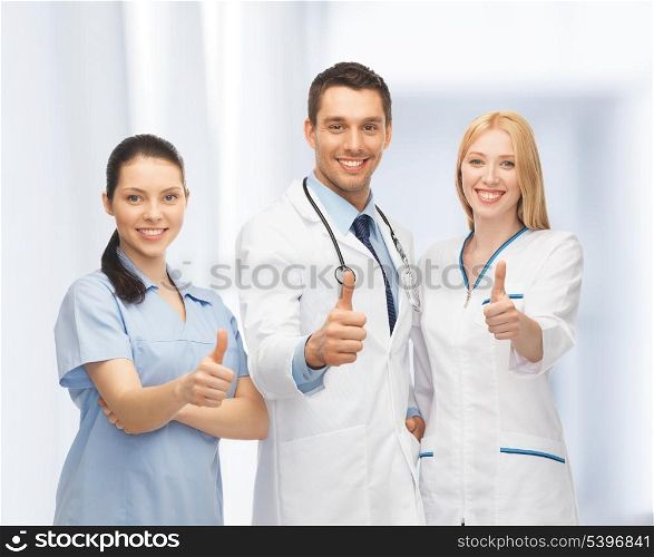 professional young team or group of doctors showing thumbs up
