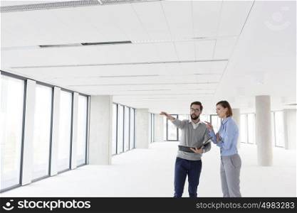 Professionals are planning over document in empty office