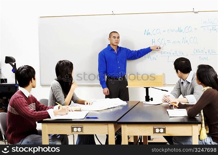 Professor teaching his students in a classroom