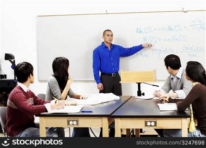 Professor teaching his students in a classroom