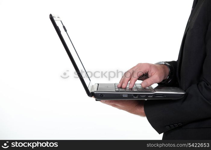 Profile of a businessman with a laptop