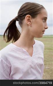Profile of a girl in a field
