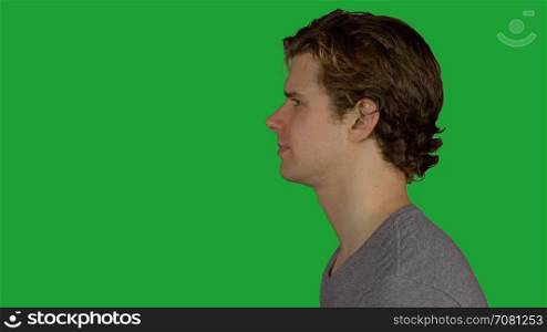 Profile of an angry yelling man (Green Key)