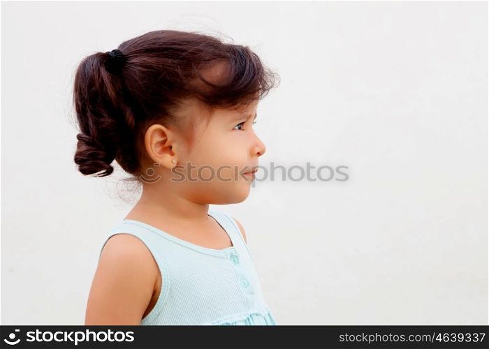Profile of funny little girl with blue dress
