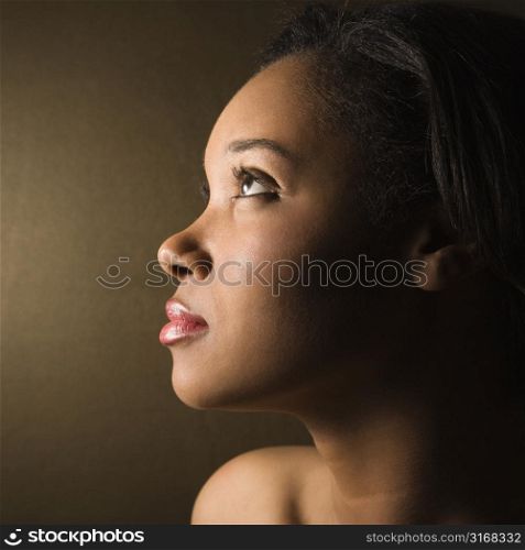 Profile of serious African-American young adult female.