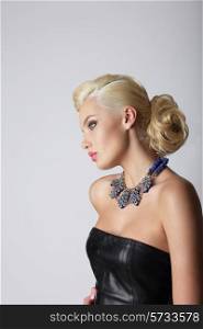 Profile of Young Contemplating Blonde with Necklace