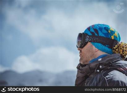 Profile Portrait of a Man Enjoying Landscape. Winter Sport in the Mountains. Wintertime Vacation. Active People Lifestyle.. Active Man Enjoying Winter Landscape