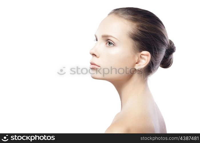 profile portrait of beautiful young woman with clean skin isolated on white background&#xA;