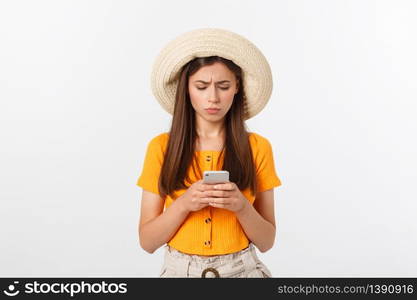 Profile portrait of good-looking attractive woman holding smartphone in hand and using it with serious face expression. Profile portrait of good-looking attractive woman holding smartphone in hand and using it with serious face expression.