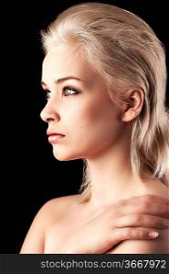 profile shot of a cute young woman with short blonde hair