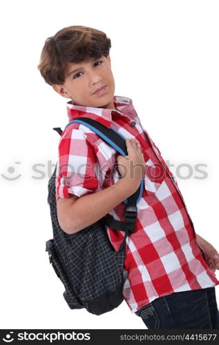 Profile shot of boy with backpack