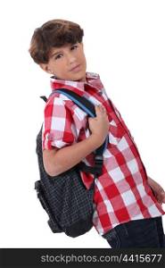 Profile shot of boy with backpack