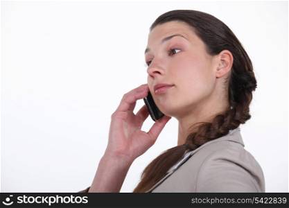 Profile shot of brunette on the phone