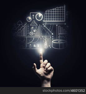 Profit chart. Human hand pointing with finger at market report chart