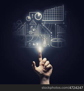 Profit chart. Human hand pointing with finger at market report chart