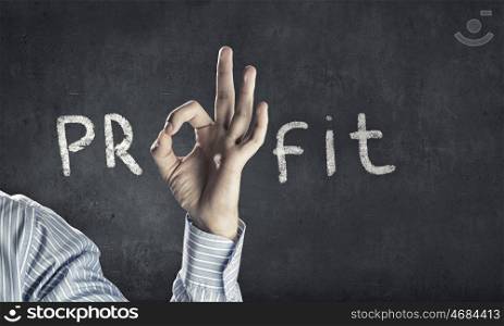 Profit concept. Word profit with human hand instead of letter