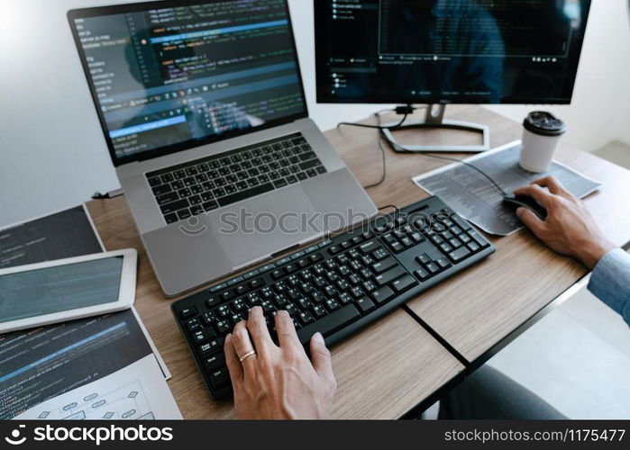 Programmer Typing Code on desktop computer, Developing programming and coding technologies concept