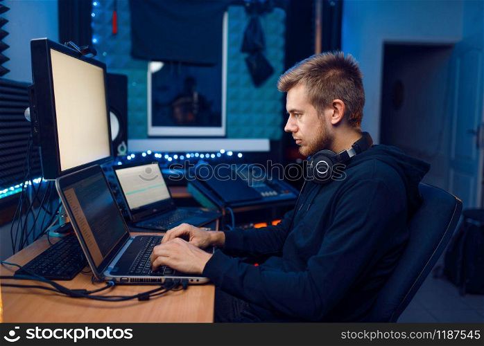 Programmer working on laptop, computer technology. IT-manager at his workplace, professional coding and encryption, network security