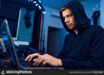 Programmer working on laptop, computer technology. IT-manager at his workplace, professional coding and encryption, network security. Programmer working on laptop, computer technology