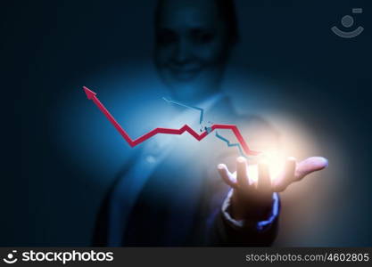 Progress concept. Close up of businesswoman holding graphs in hand