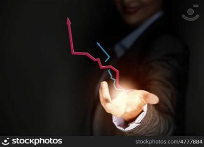 Progress concept. Close up of businesswoman holding graphs in hand