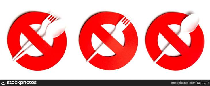 prohibition sign cut out of red paper with disposable plastic forks and spoons. no disposable tableware