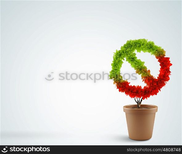 Prohibition symbol. Image of pot plant shaped like prohibition sign