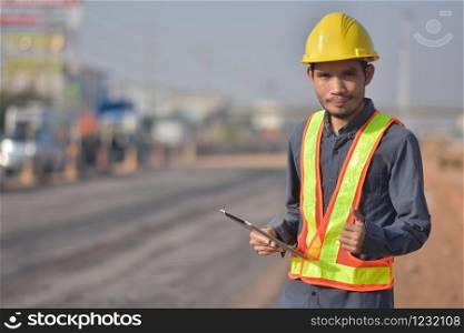 Project Engineer communication tablet road construction background