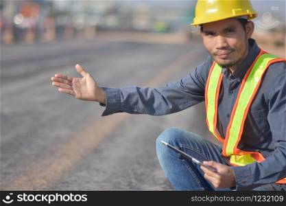 Project Engineer communication use tablet road construction background
