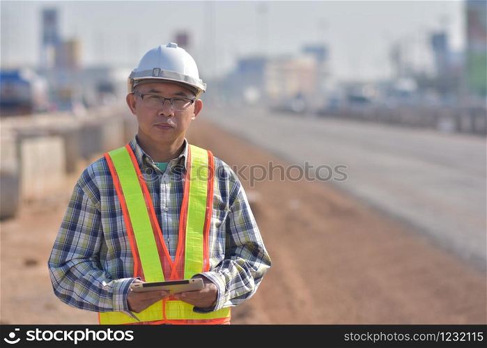Project manager holding tablet inspection estate construction building project