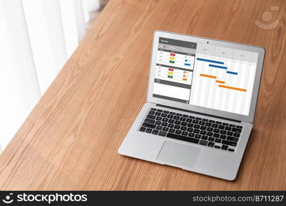 Project planning software for modish business project management on the computer screen showing timeline chart of the team project. Project planning software for modish business project management