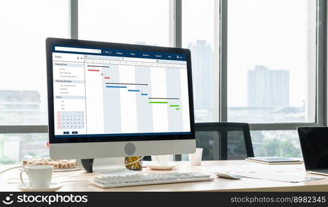 Project planning software for modish business project management on the computer screen showing timeline chart of the team project. Project planning software for modish business project management